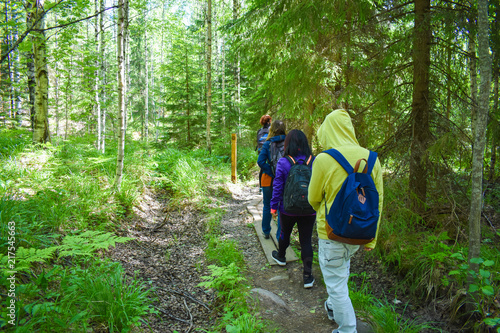 A group of friends hiking together in Oravivuori in Finland.