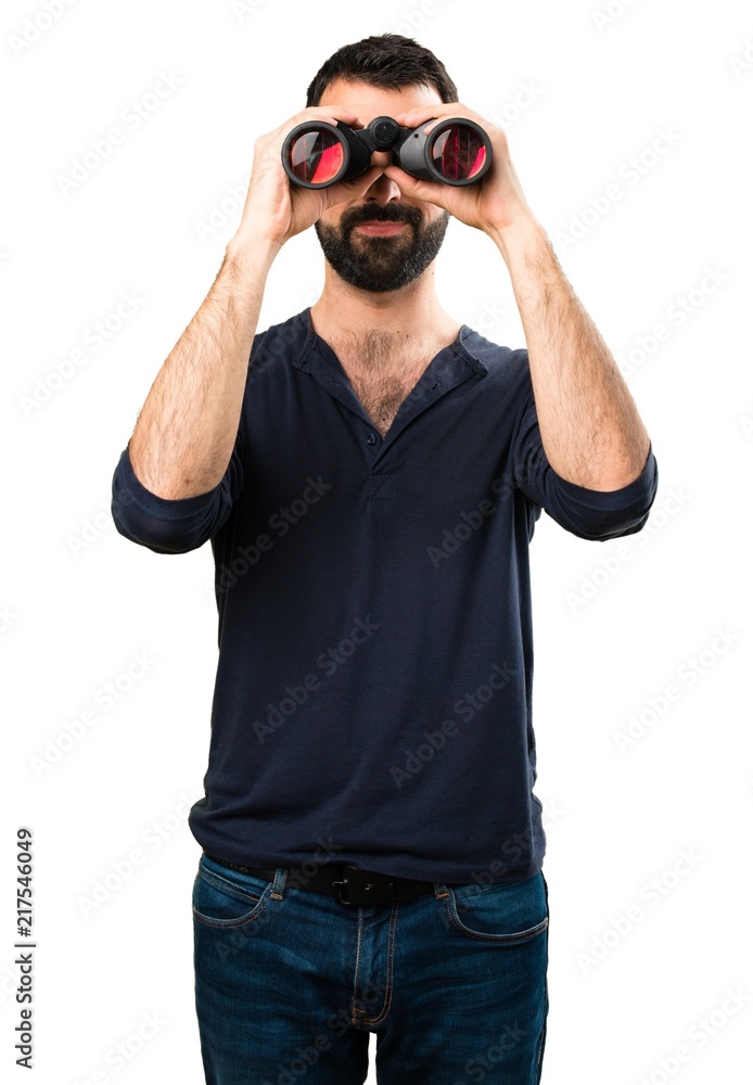 Handsome man with beard with binoculars Handsome man with beard with binoculars