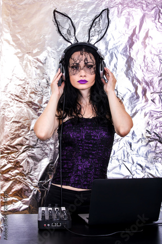 DJ halloween girl woman headpgone mask black celebrate corset costume fun brunette playing mixing purple lace