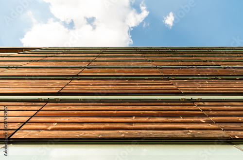 Low Angle View of Roof Tiles against Cloudy Sky