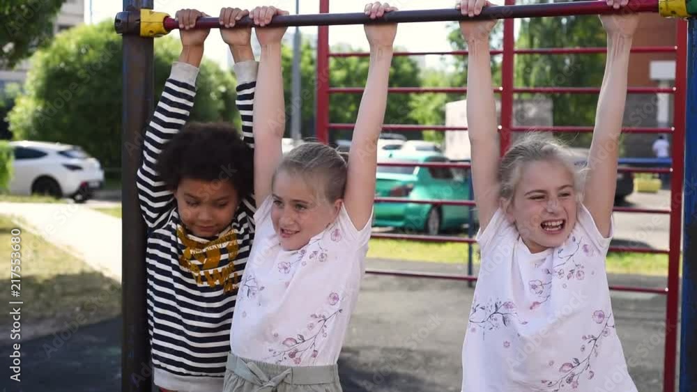 Cute and funny identical twins girls. Blonde beatiful twins schoolgirls smiling in the camera. Twins video portrait. Shoot in june of 2018 Cute and funny identical twins girls. Blonde beatiful twins schoolgirls smiling in the camera. Twins video portrait. Shoot in june of 2018
