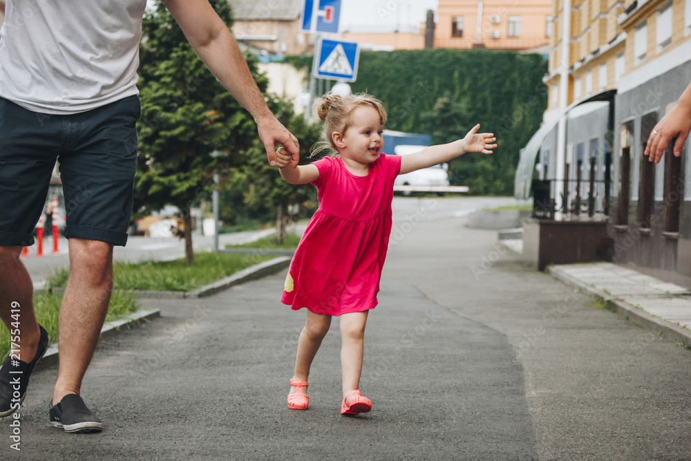 Man walking with little girl