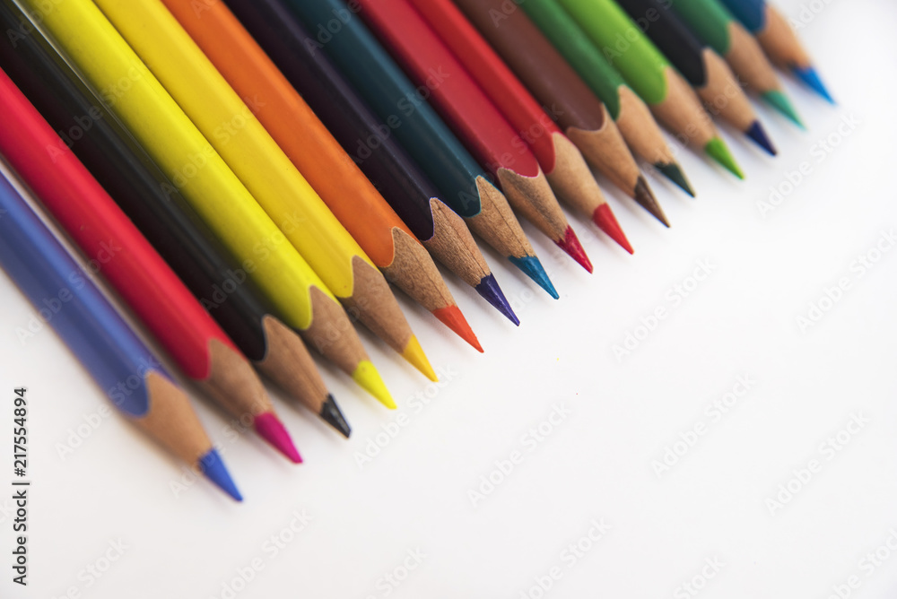 Color pencils lie diagonally on a white background Color pencils lie diagonally on a white background