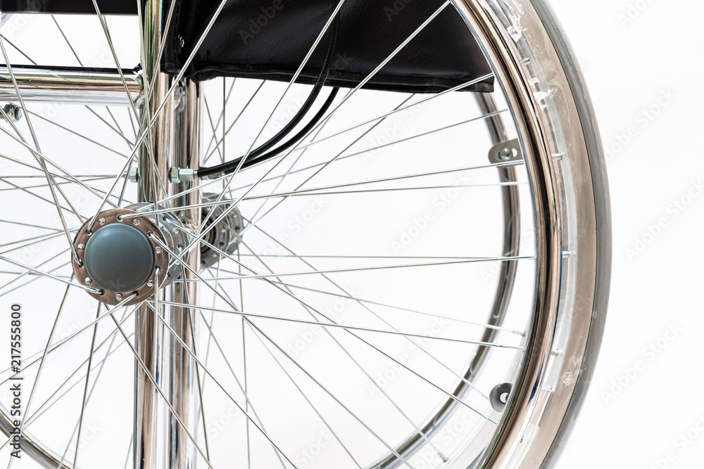 close-up of wheelchair on white background