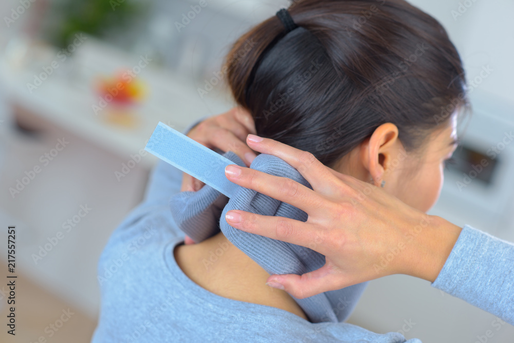 woman putting a cervical collar on woman putting a cervical collar on