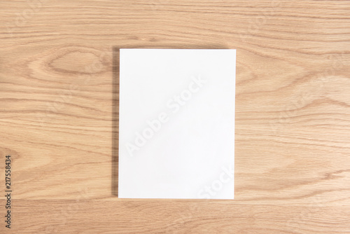 White empty blank cover book on wooden background.