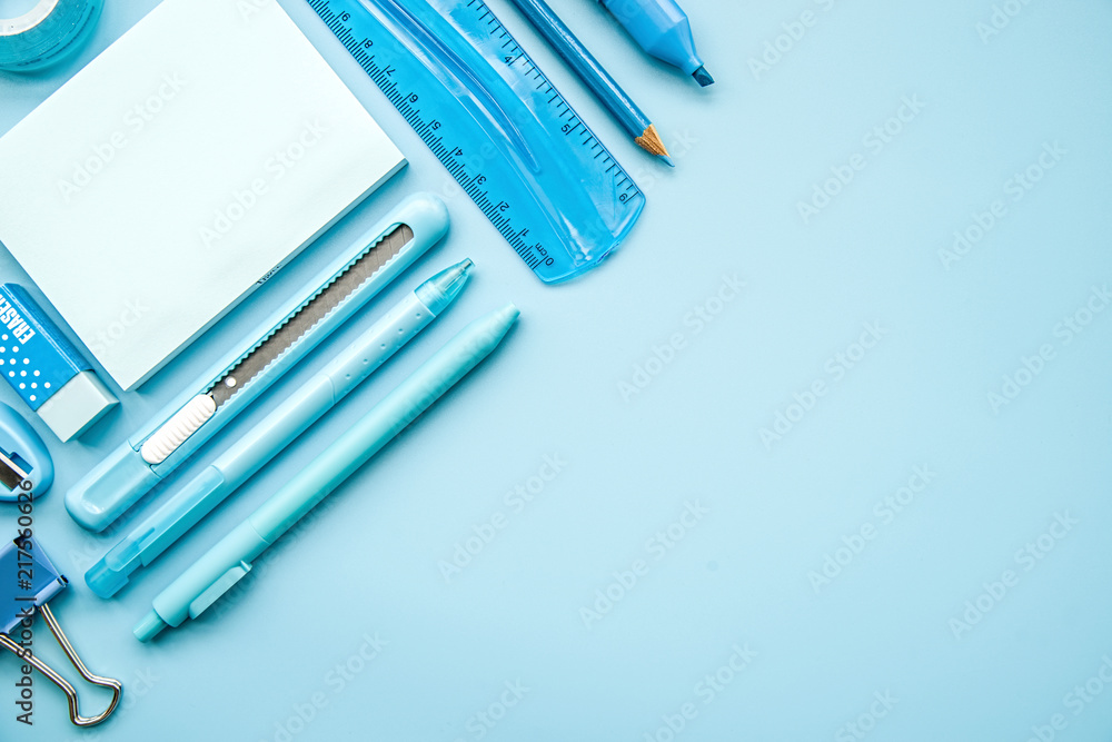 blue stationery on blue background top view flat lay with copy space blue stationery on blue background top view flat lay with copy space