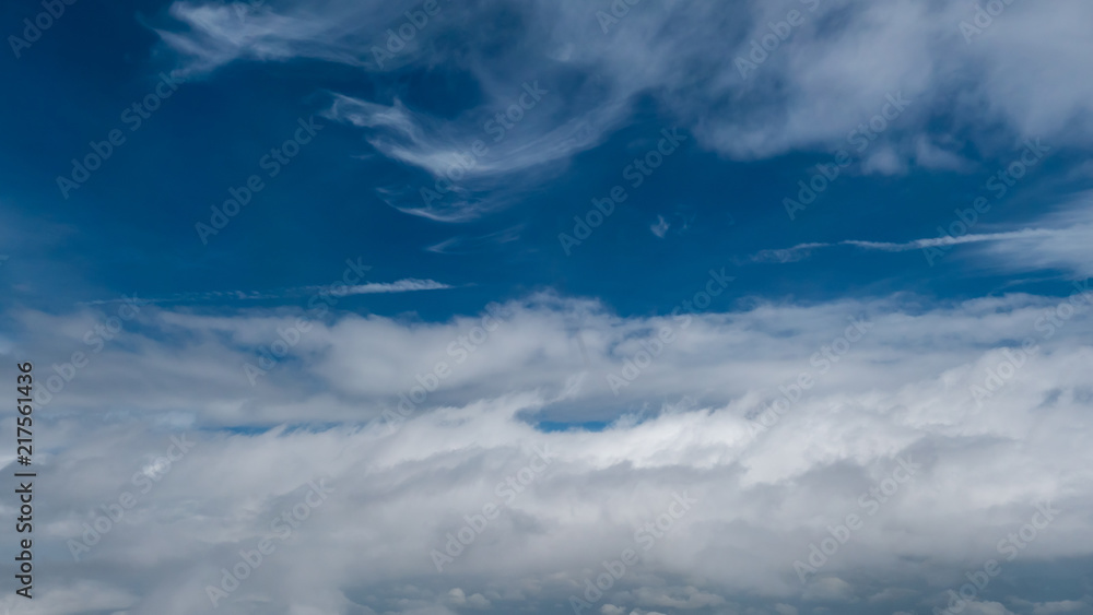 Some soft clouds stacked in the sky Some soft clouds stacked in the sky