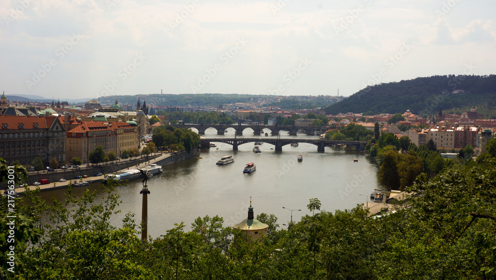 Panoramic view on Prague and Vltava with bridges and boats, Czech Republic