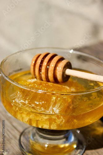 A jar of honey on the table.