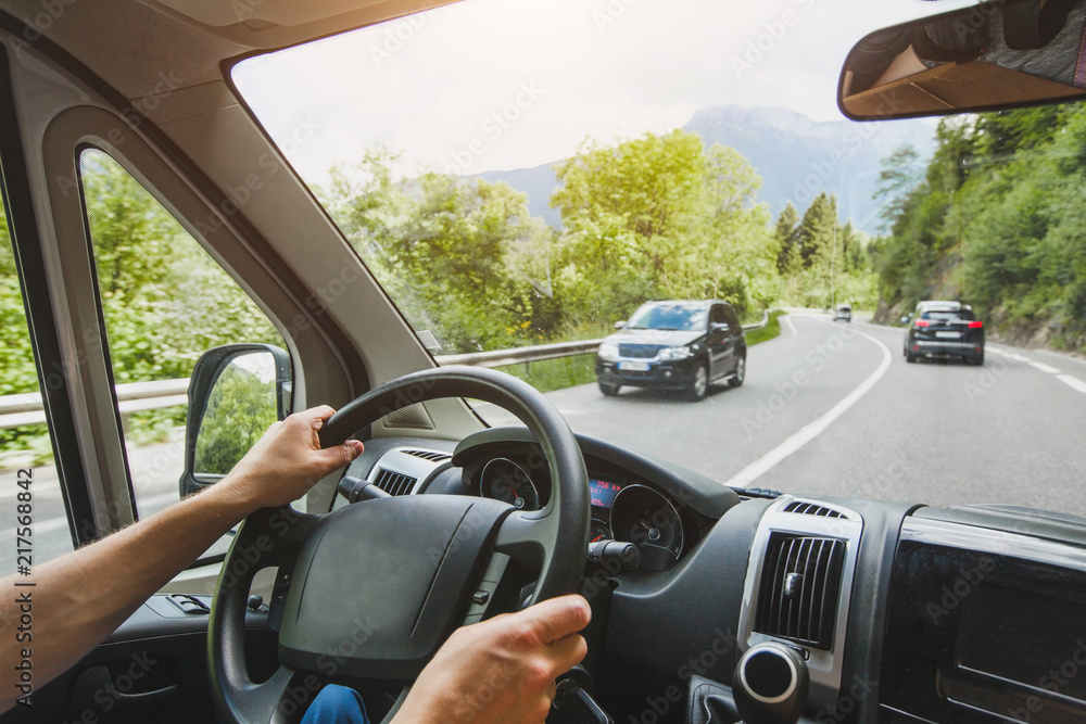 hands of truck driver on steering wheel, delivery service, transportation occupation, man driving big cargo car on the road