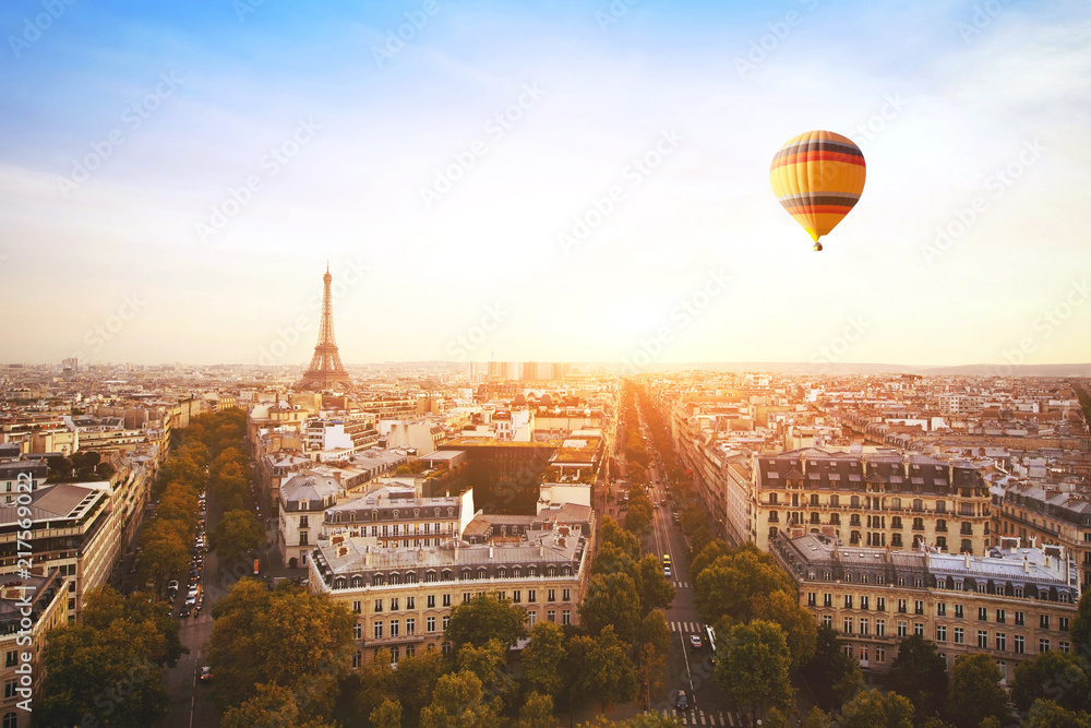 Fototapeta premium dream travel destination, beautiful panoramic view of Paris with Eiffel Tower and flying hot air balloon, France