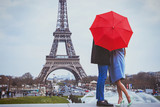 romantic holidays for couple in Paris, honeymoon vacation in France, Europe, man and woman kissing near Eiffel tower