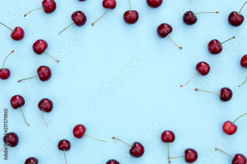 Fresh sweet cherries on blue background