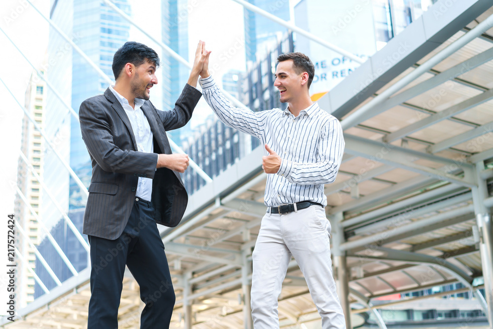 Two businessman happy, Asia Middle East and Europe success for contact at outdoors. concept of business successful dealing. Two businessman happy, Asia Middle East and Europe success for contact at outdoors. concept of business successful dealing.