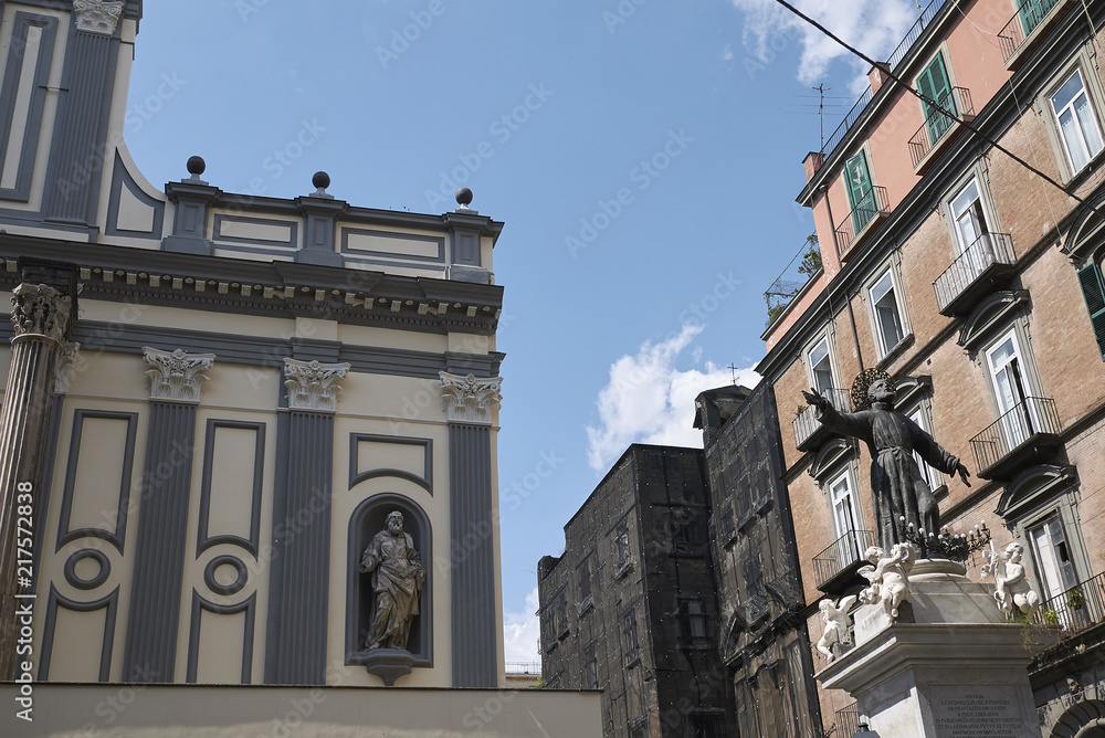 Naples, Italy - July 24, 2018 : San Paolo Maggiore dome and San Gaetano monument
