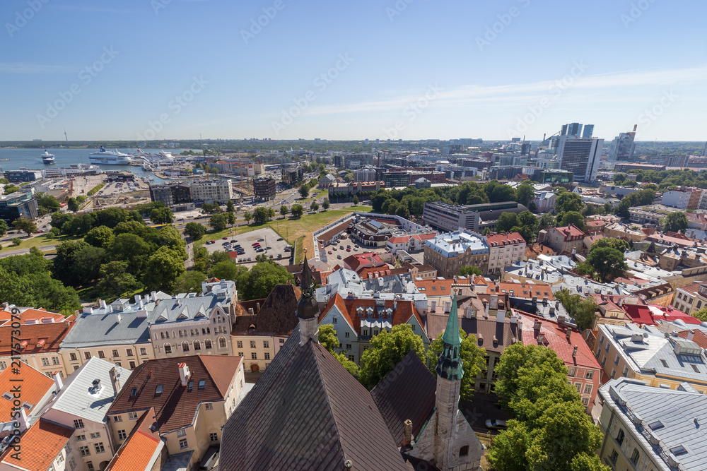 Old buildings at the Old Town, harbor and downtown in Tallinn, Estonia, viewed from above on a sunny day in the summer.