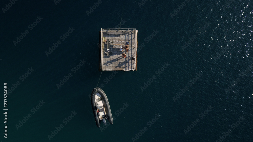 Aerial view of a Speed boat in the middle of the ocean Aerial view of a Speed boat in the middle of the ocean