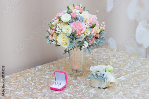 Unusual wedding bouquet and rings