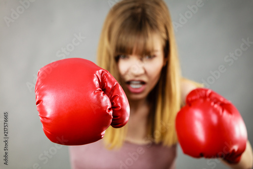 Woman wearing boxing gloves