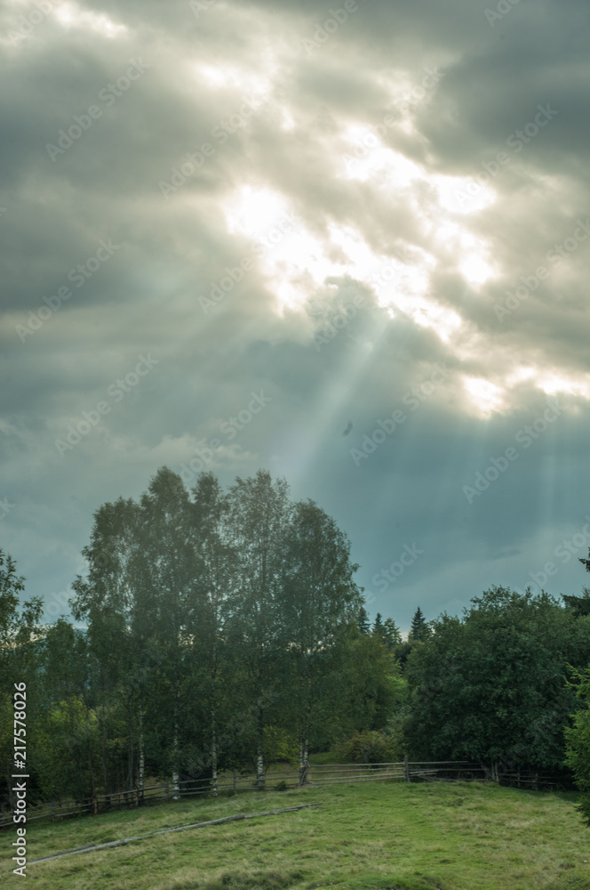 Carpathian mountains meadow, sun rays under the hills, clouds 2 Carpathian mountains meadow, sun rays under the hills, clouds 2