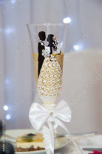 Beautiful wedding champagne glass on a blurry background