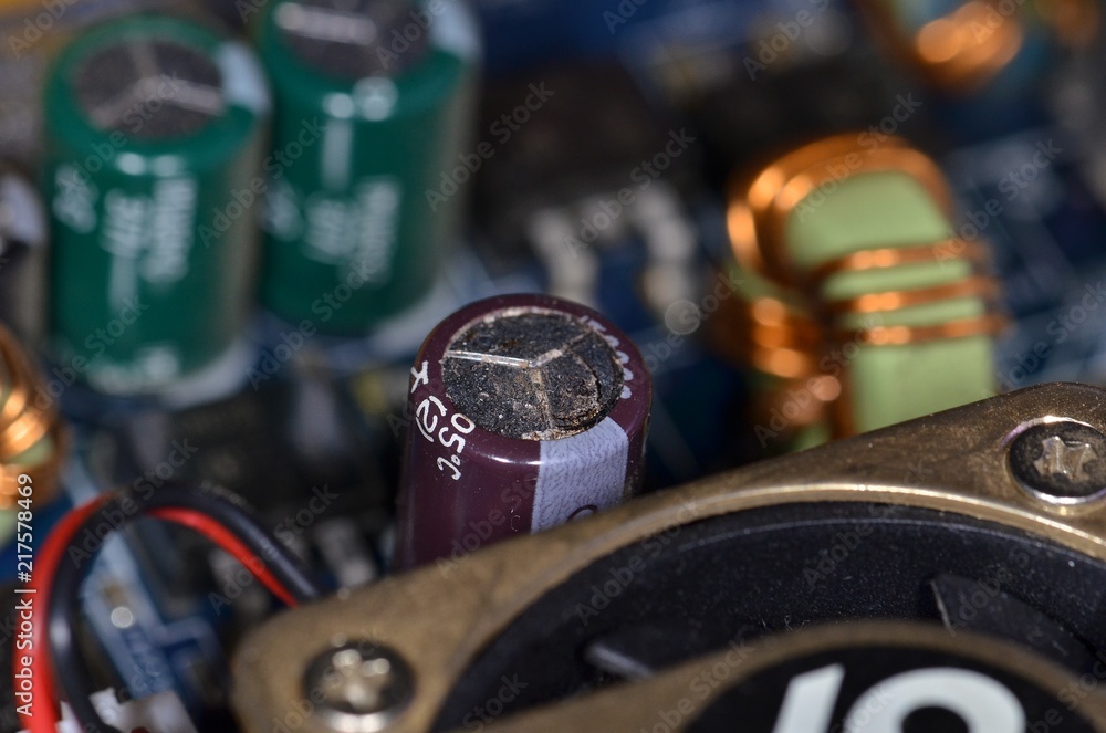 Defective swollen leaked electrolytic capacitor on old computer