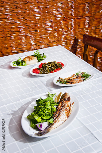 Blue fish and Armenian appetizer tahini topik, sea fennel and dried mackerel photo