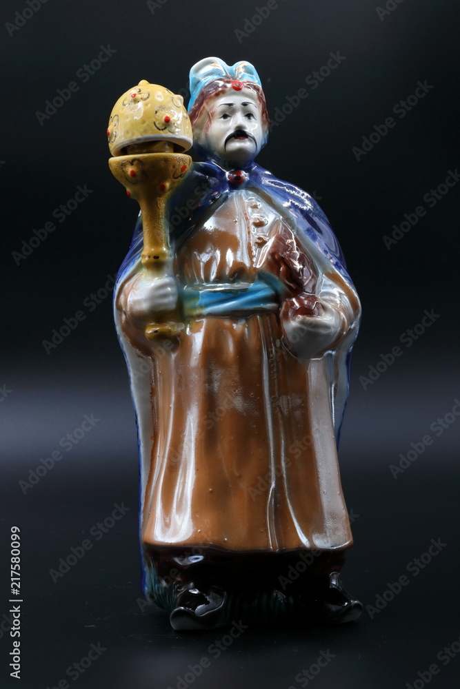 Figure of the dvolny grandee with a mace in a blue raincoat and with moustaches. 