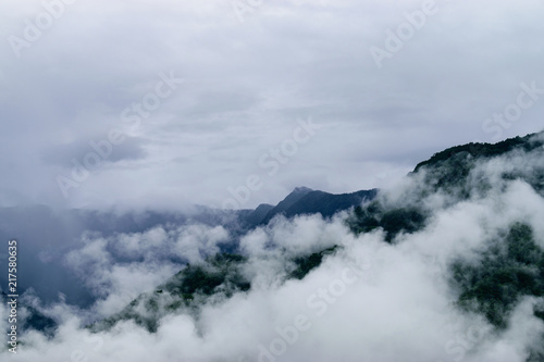 Fototapeta Naklejka Na Ścianę i Meble -  Clouds Floating Around The Mountain