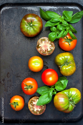 Fresh tomatoes on dark background. Top view
