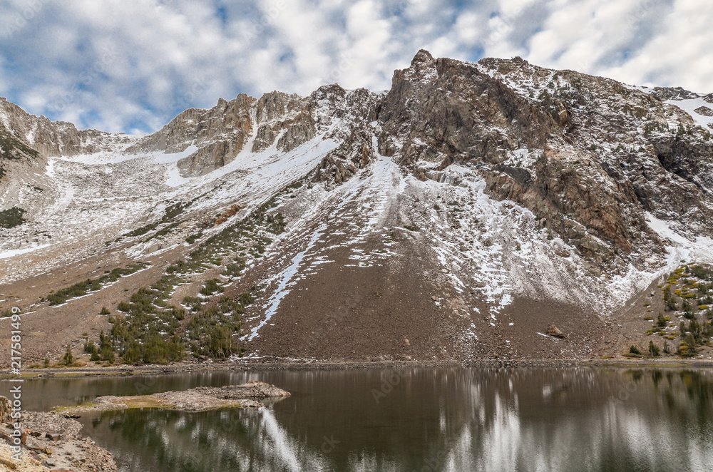 Fototapeta premium snow covered slopes of Mt. Dana and shores of Ellery Lake Tioga Pass Road, Lee Vining county, California