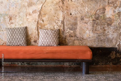 Pillows on a red cloth sofa