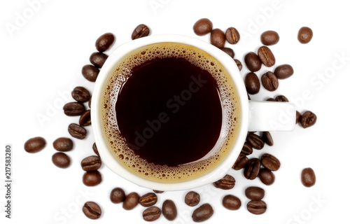 Cup of coffee with beans isolated on white background, top view