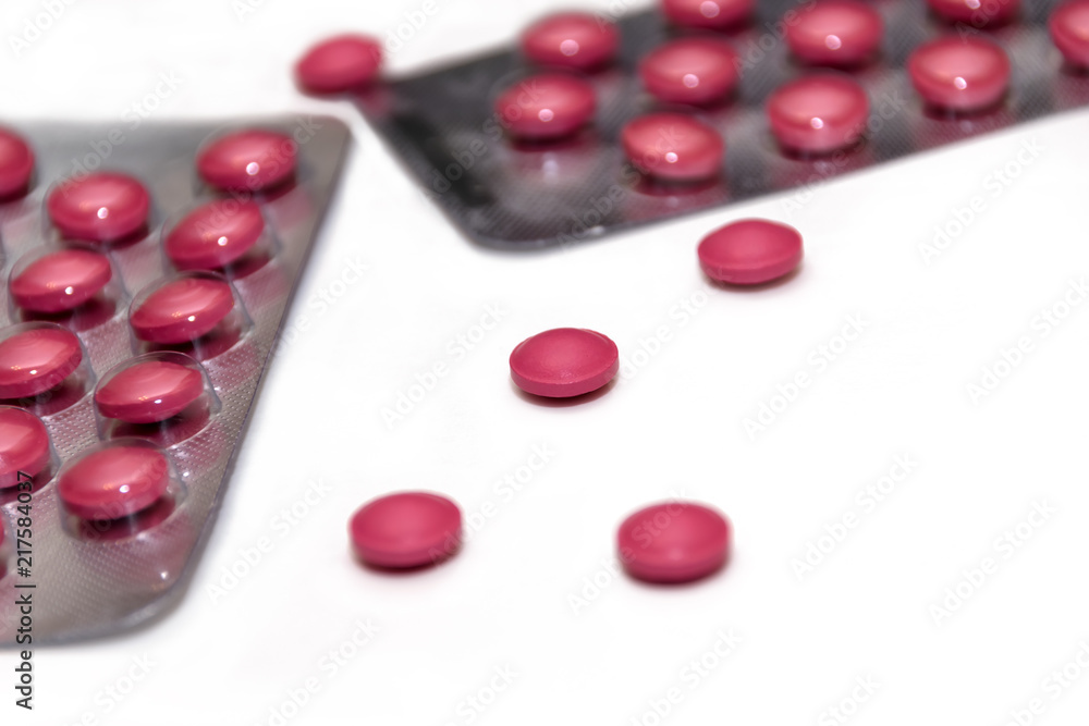 Red pills on white background Red pills on white background
