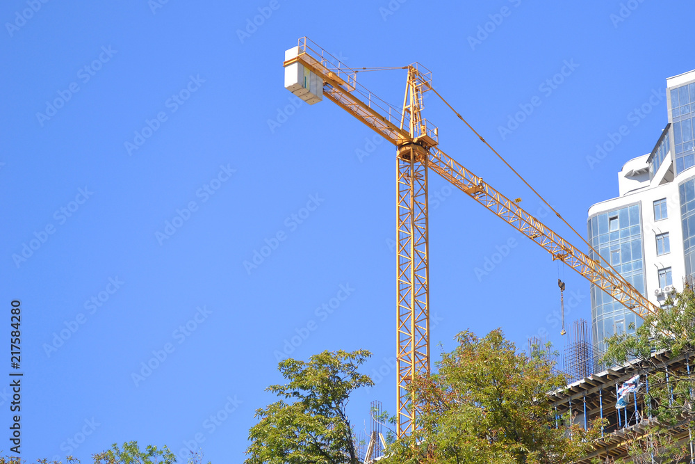 Construction of an apartment house with a crane.