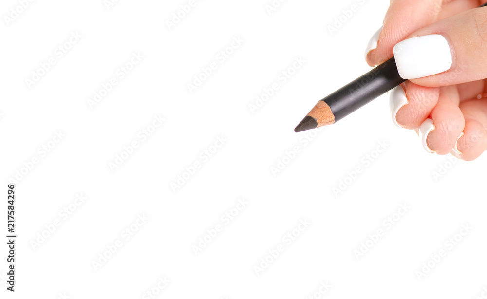 Black eye pencil in hand on white background isolation Black eye pencil in hand on white background isolation