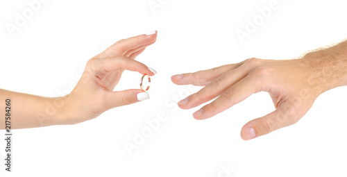 Wedding rings two hands on a white background