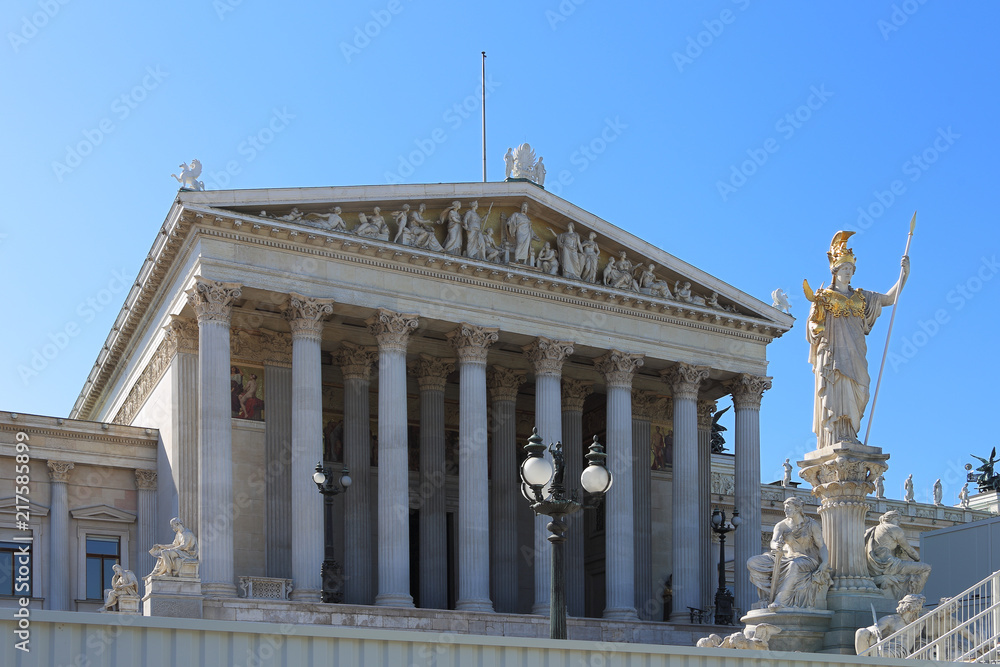 Obraz premium Austrian parlament facade lookig at the famous historical ring street of the city - Ringstrasse