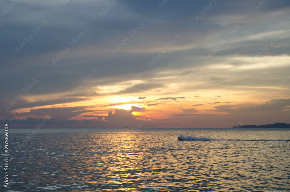 Speed boat on a sunset background