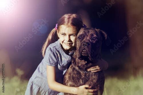 little girl and dog outdoors