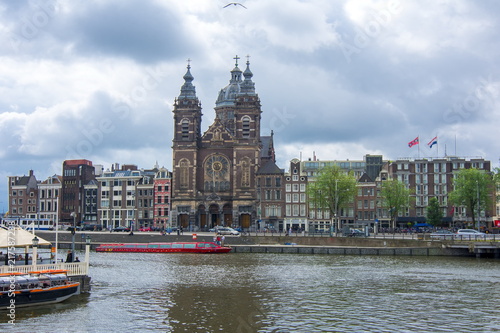 Basilica of Saint Nicholas (Sint Nicolaaskerk) and Amsterdam canals, Netherlands