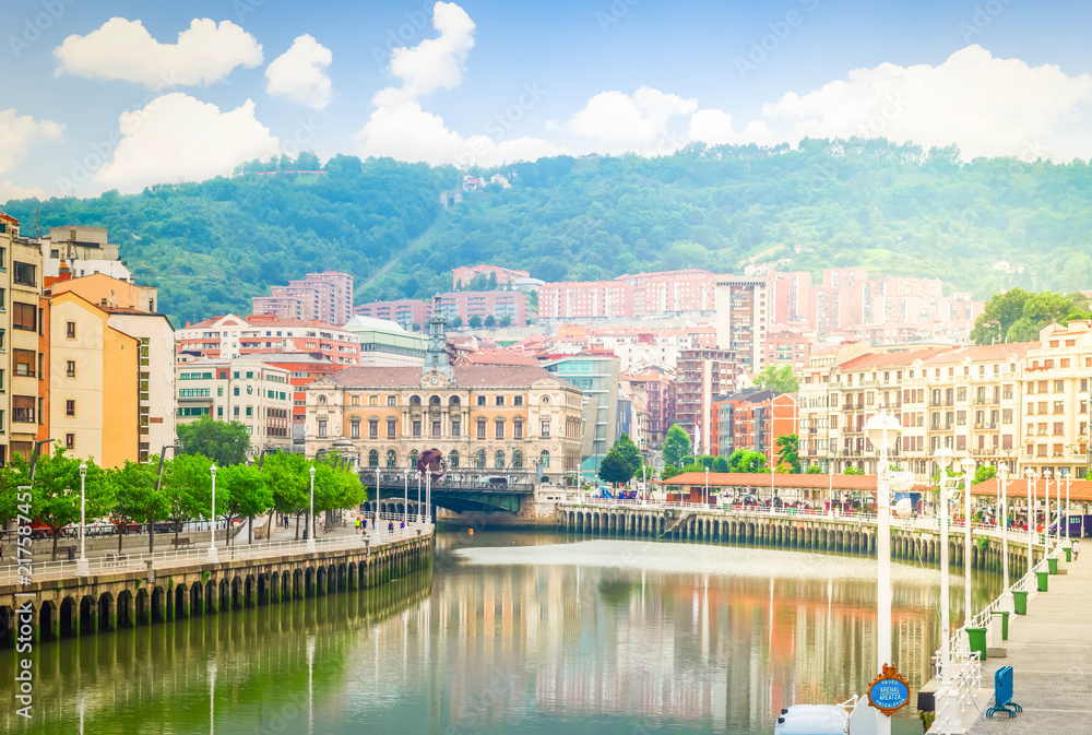 view of old town of Bilbao with river Nervion embankment, Spain, retro toned