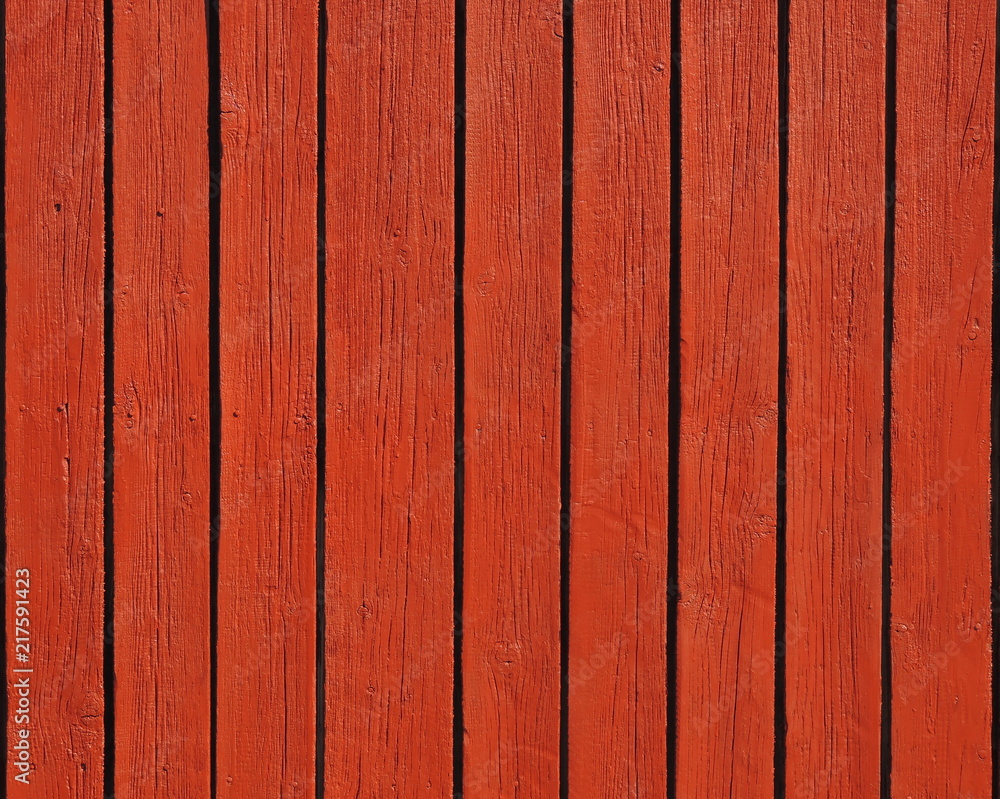 Fototapeta premium Red orange wooden vertical boards texture background.