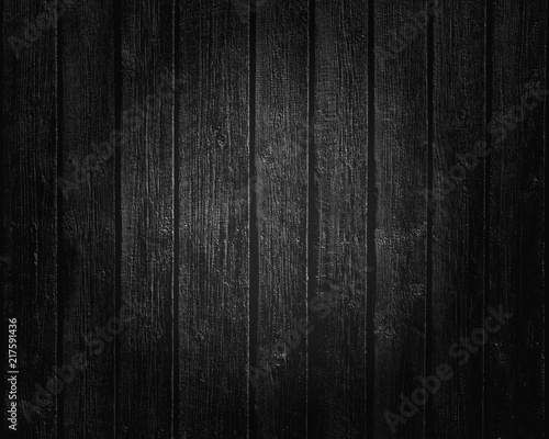 Black wooden boards texture background with lighting