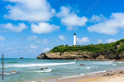 On the beach in Biarritz city with the lighthouse in the background. Basque country of France.