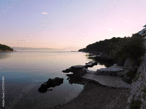 the coast of the Croatian island in the light of the rising sun