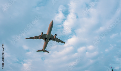 Airplane taking off in sky and clouds travel vacation concept photography background