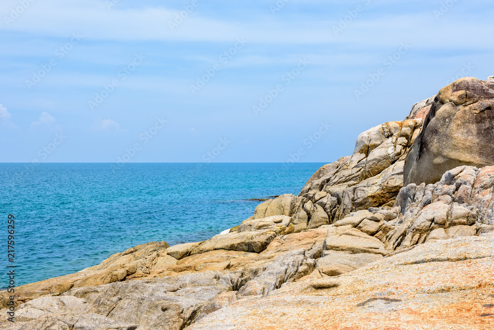 Beautiful natural landscape of rock along the coastline with blue sea under the summer sky at Koh Samui island, Surat Thani province, Thailand Beautiful natural landscape of rock along the coastline with blue sea under the summer sky at Koh Samui island, Surat Thani province, Thailand