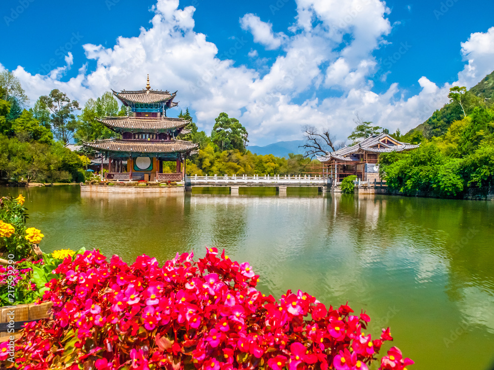 Black Dragon Pool and Moon Embracing Pavilion on sunny day, Lijiang, Yunnan Province, China. Black Dragon Pool and Moon Embracing Pavilion on sunny day, Lijiang, Yunnan Province, China.